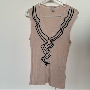 Sleeveless blush top with ruffle detail